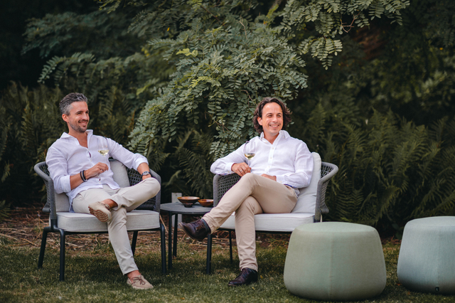 Two men sitting outside in the garden
