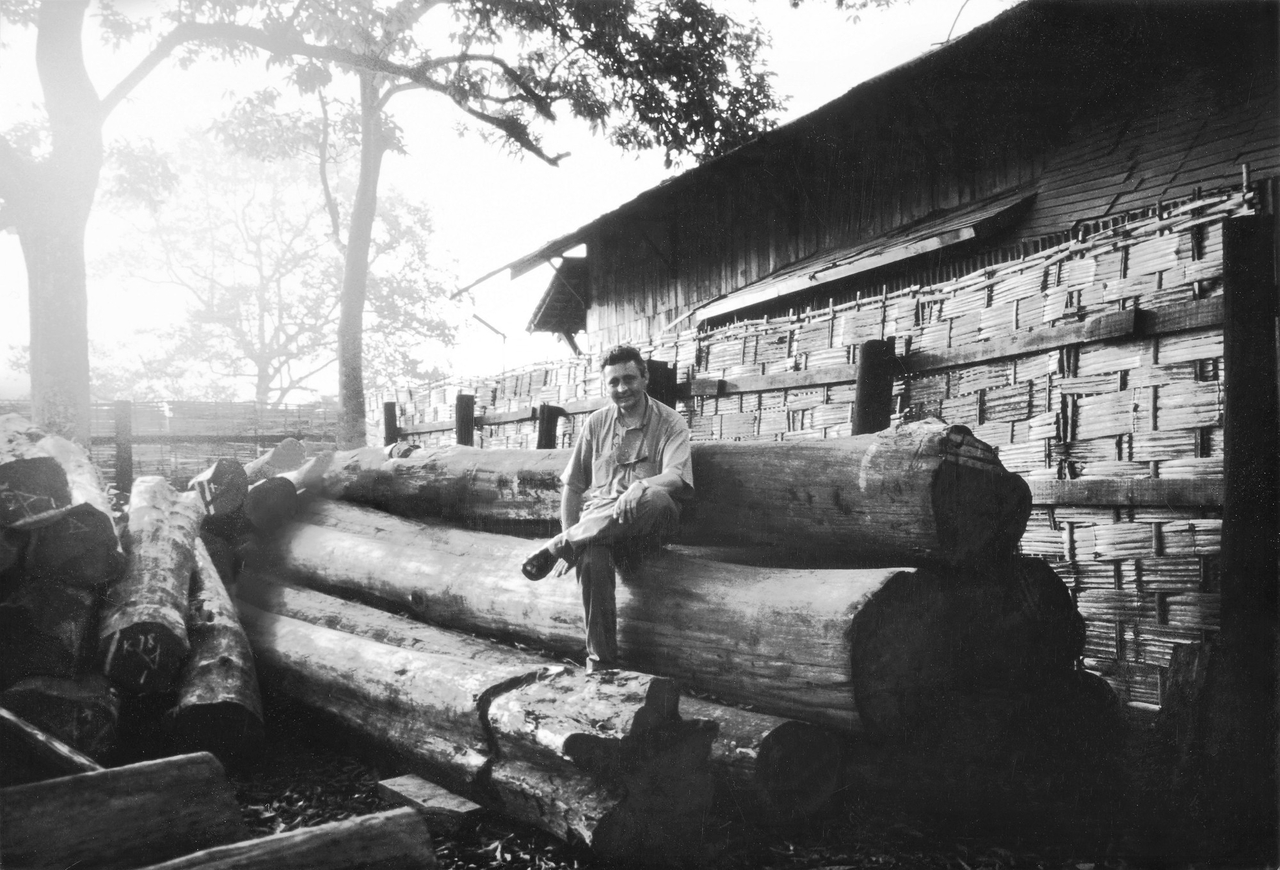 Man sitting on a log FR